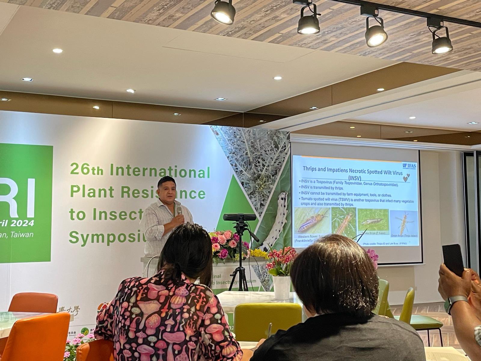 faculty presenting research data in Taiwan
