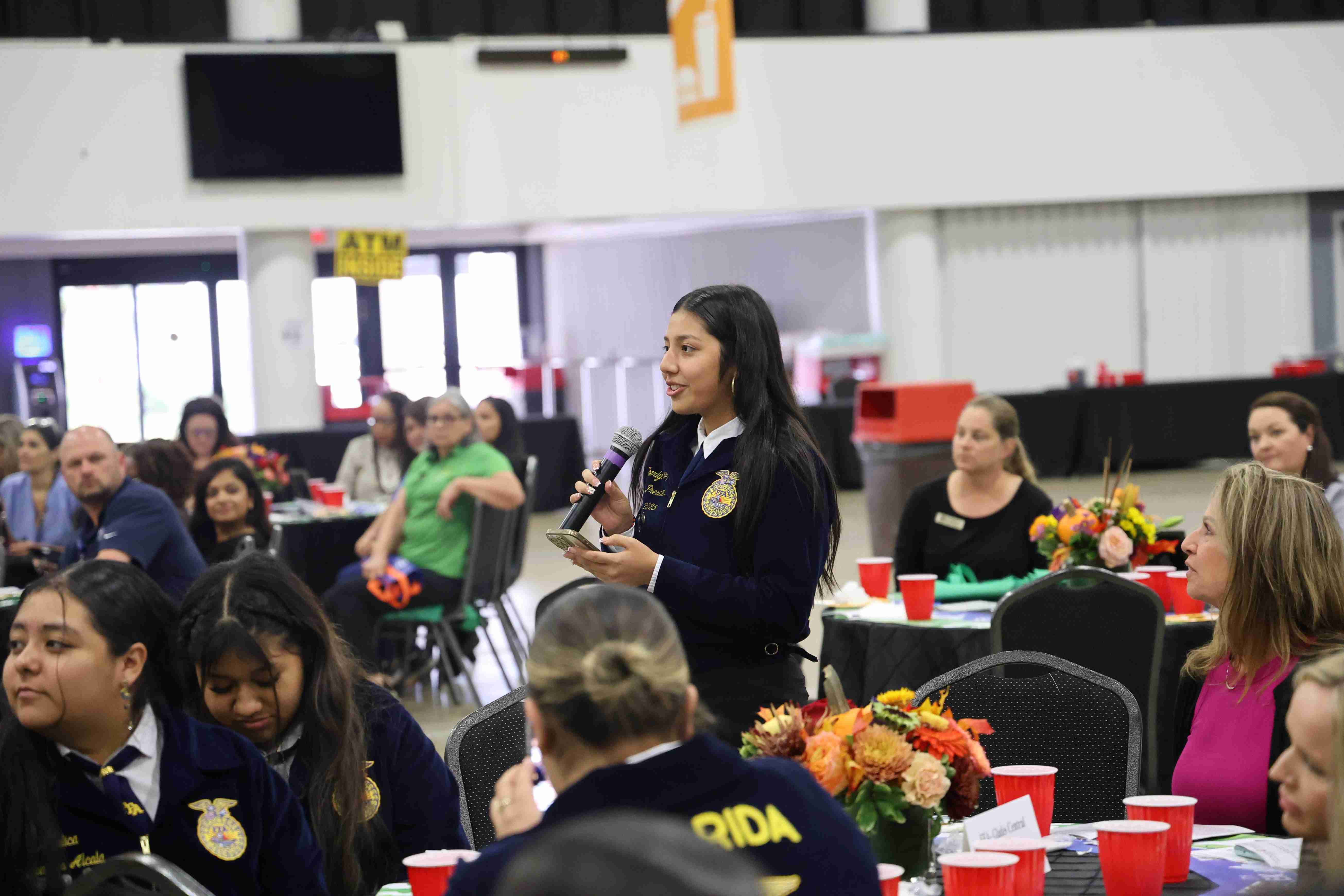 girl speaker through microphone